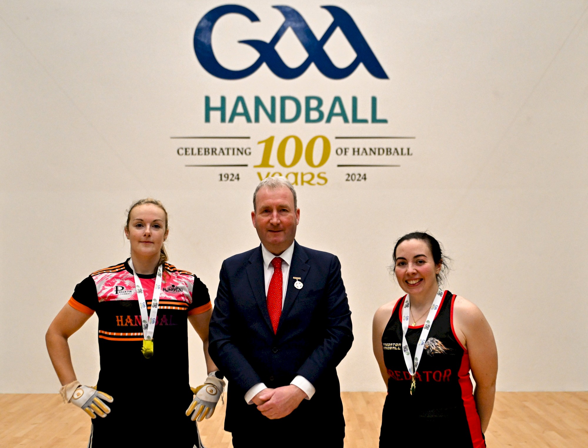 3 November 2024; Martina McMahon of Broadford, Limerick, left, and Aoife McCarthy of Mullingar, Westmeath, with GAA Handball president Conor McDonnell after their victory in the Ladies Open doubles final during day nine.jpg